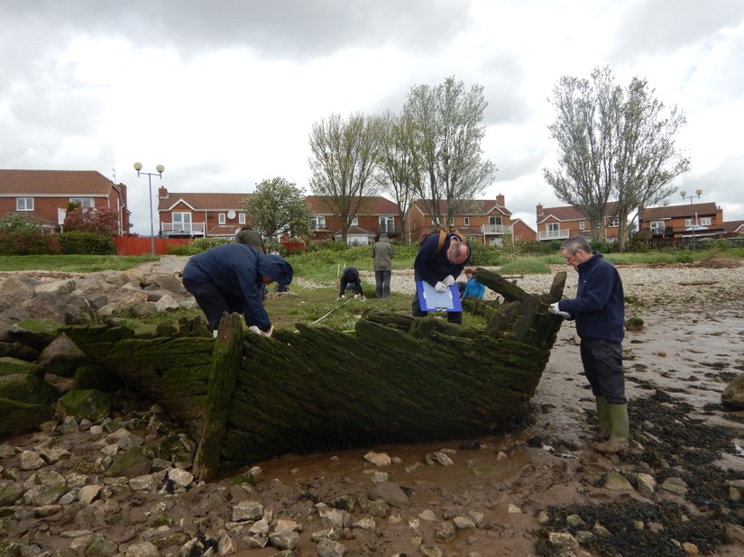 Volunteers recording the remains of a vessel