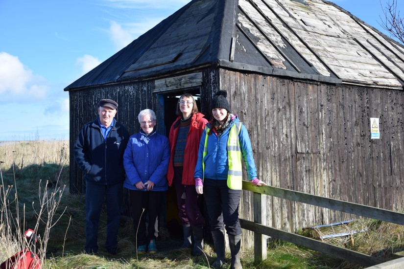 Standing outside the fisherman's hut