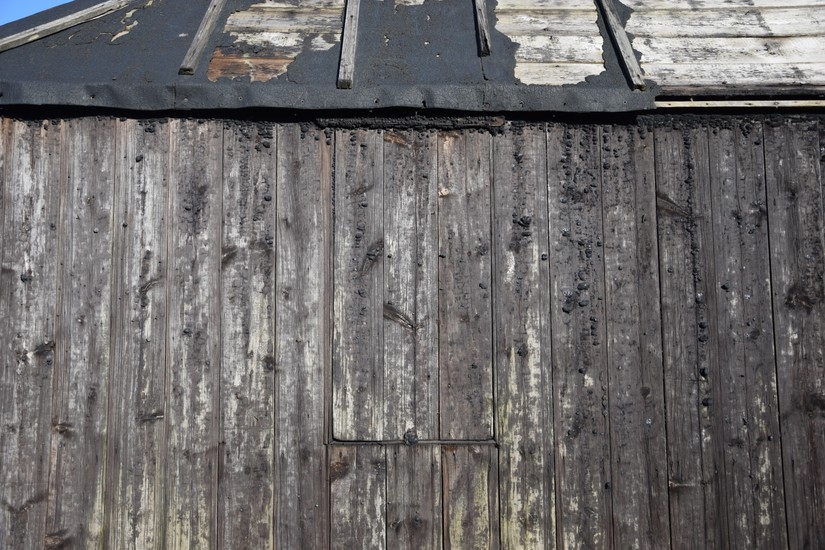 The remains of the tarring can be seen on the walls and the roof is covered in tarred canvas sails