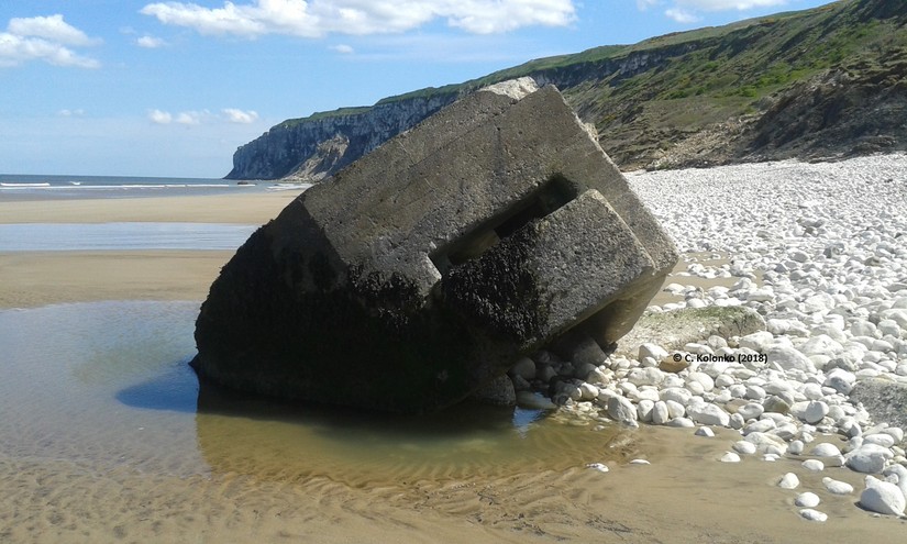 Bullet Proof Machine Gun Pillbox, also known as an ‘Eared’ Pillbox, slowly being destroyed by coastal erosion and shifting sands