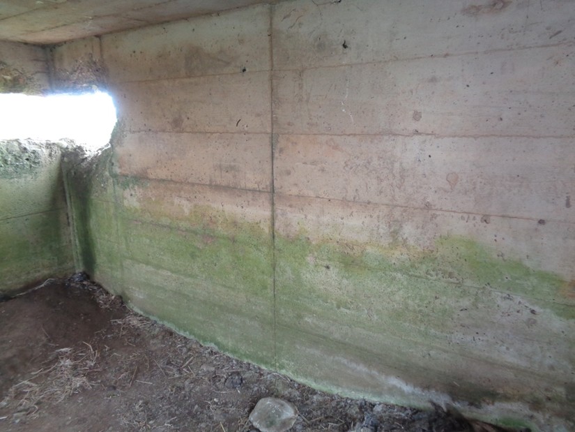 Square pillbox interior showing wooden shuttering impressions