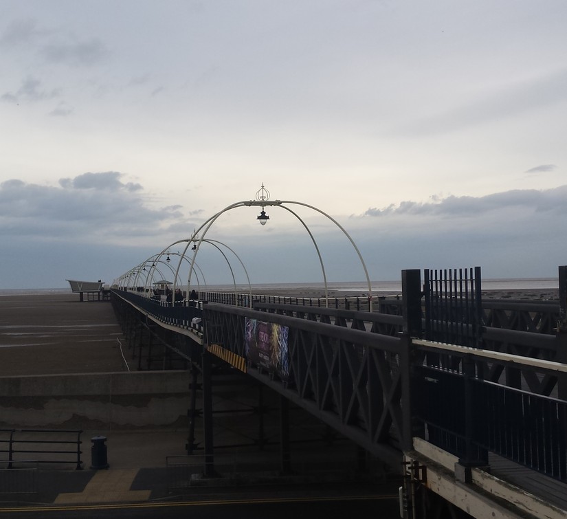 Southport pier reaching out over the beach
