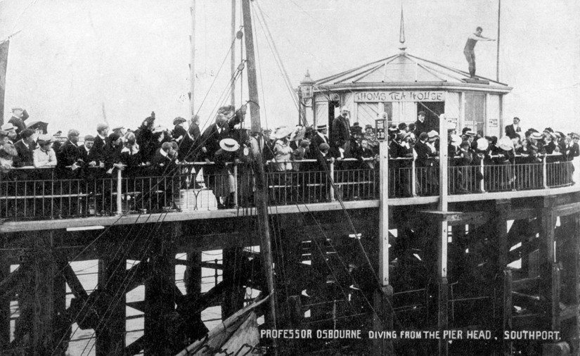 Professor Osbourne dives of the roof of Thom's Tea House