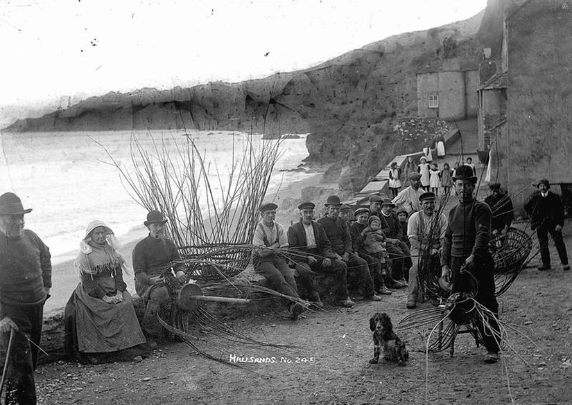Hallsands villagers with crab pots, taken c.1912. 4th from left: Roger's grandfather. On right (in bowler hat): Roger's great grandfather.