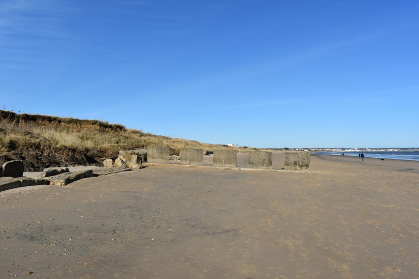 Well preserved anti-tank cubes built in 1941 and a tumbled anti-tank wall built in 1940.