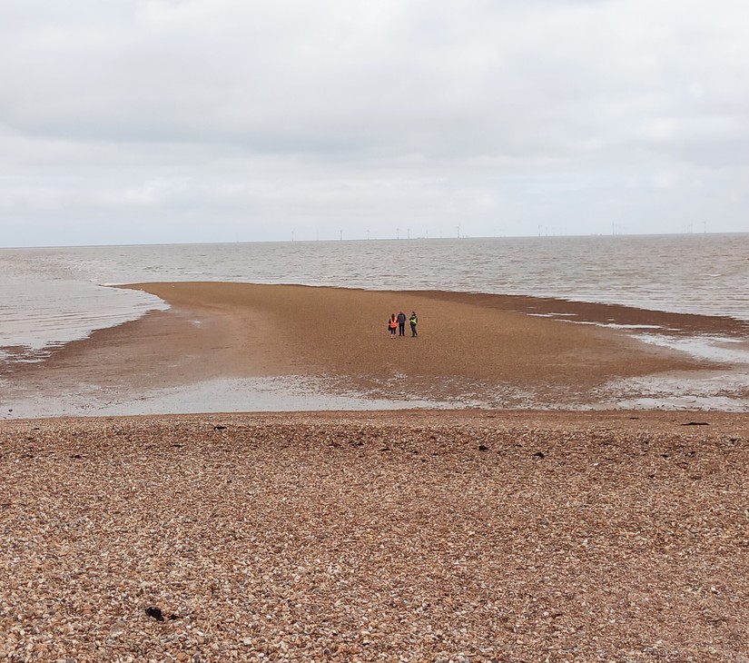 Rebecca from the Coasts in Mind team with members of Timescapes Kent on the foreshore in Whitstable during the Memory Walk