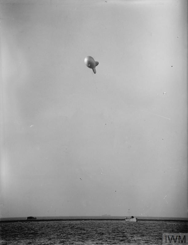 An auxiliary vessel flying a barrage balloon 